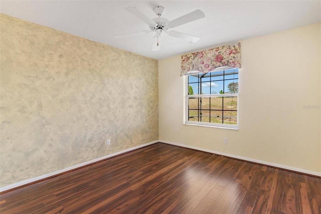 11614 Southeast 172nd Loop Summerfield, FL 34491 - Photo 26 of 55 wooden floor in an empty room with a window