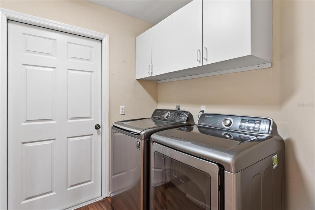 11614 Southeast 172nd Loop Summerfield, FL 34491 - Photo 31 of 55 a utility room with dryer and washer