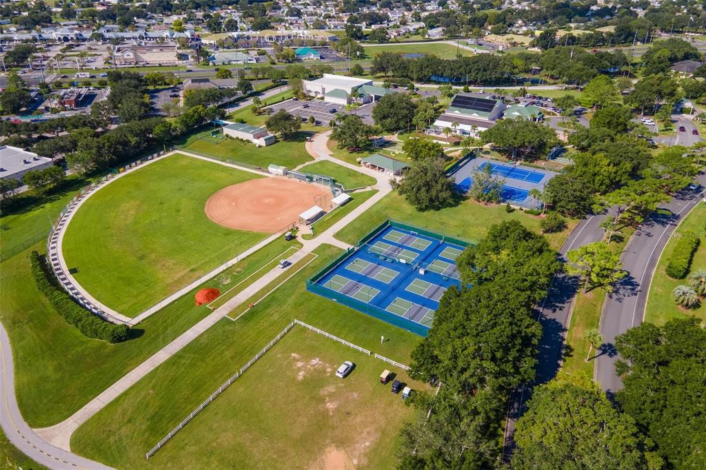 11614 Southeast 172nd Loop Summerfield, FL 34491 - Photo 45 of 55 an aerial view of a tennis ground and a cars park side view