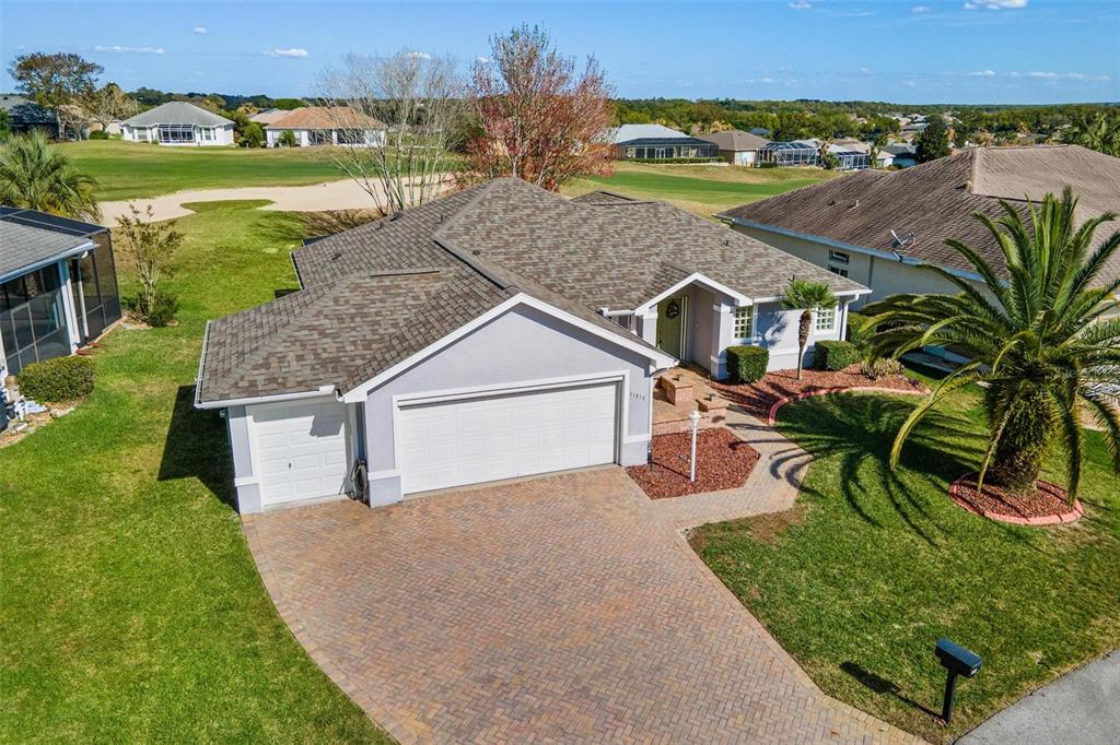 11614 Southeast 172nd Loop Summerfield, FL 34491 - Photo 53 of 55 an aerial view of a house with a yard and lake view