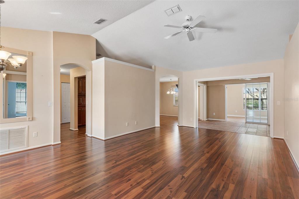 11614 Southeast 172nd Loop Summerfield, FL 34491 - Photo 9 of 55 a view of an empty room with window and wooden floor