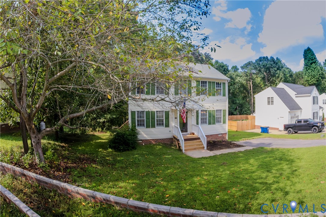 9424 Lockberry Ridge Loop Richmond, VA 23237 - Photo 1 of 24 Two-story residence with white siding and green sh