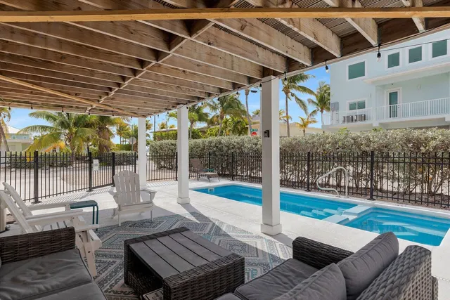 a view of a chairs and table on the deck