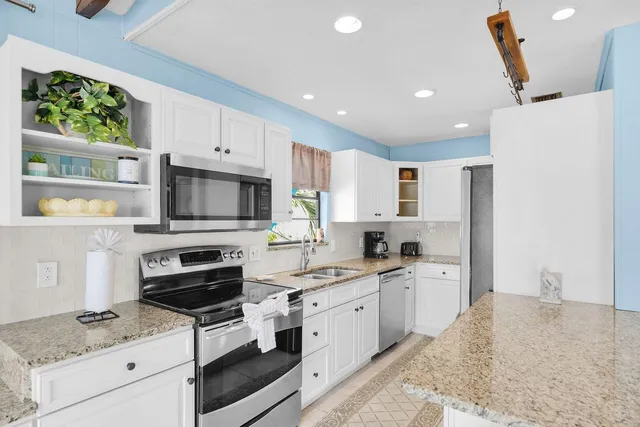 a large spacious bedroom with a large bed and furniture