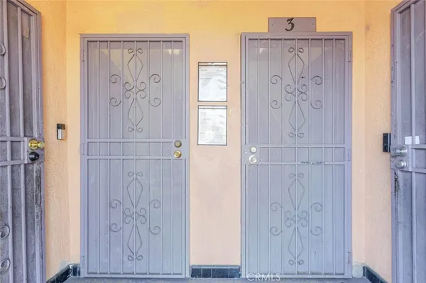 a bathroom with a painting on the wall