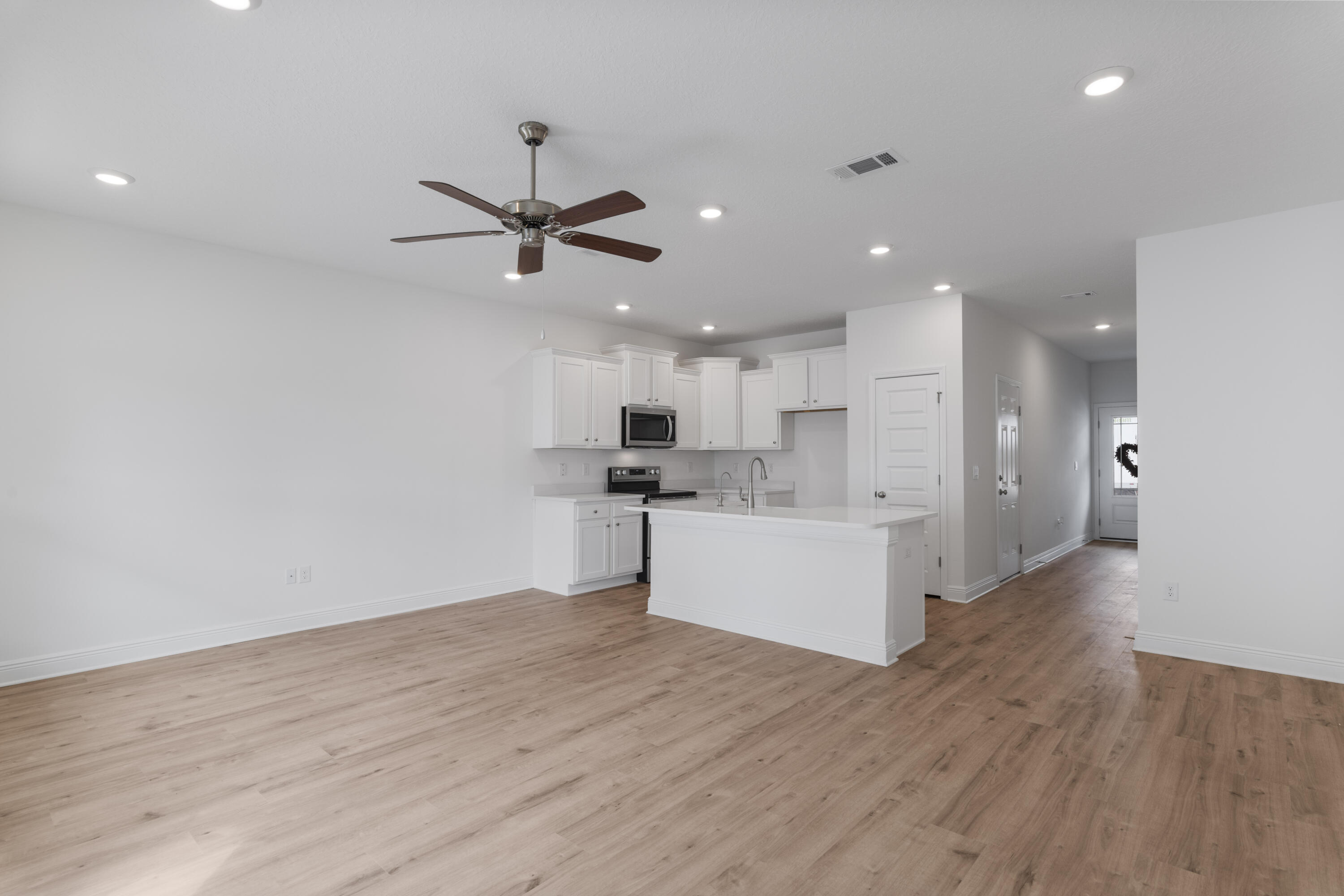 28 Redbird Loop Destin, FL 32541 - Photo 9 of 23 a view of kitchen with cabinets appliances and a ceiling fan