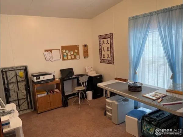 a workspace with furniture and window