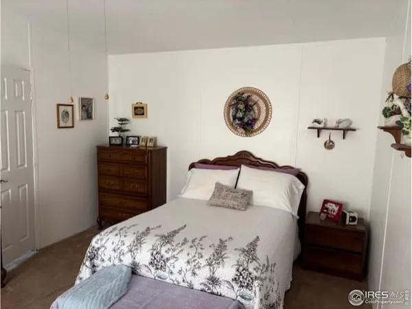 a bedroom with a bed and a table