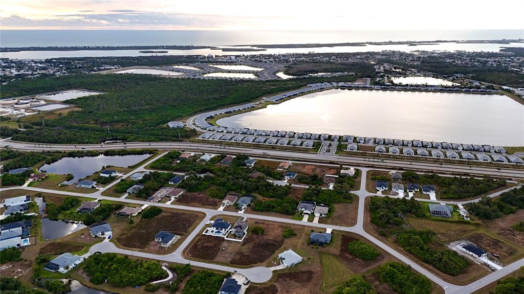 116 Temper Lane Rotonda West, FL 33947 - Photo 3 of 6 an outdoor view of the house with lake view
