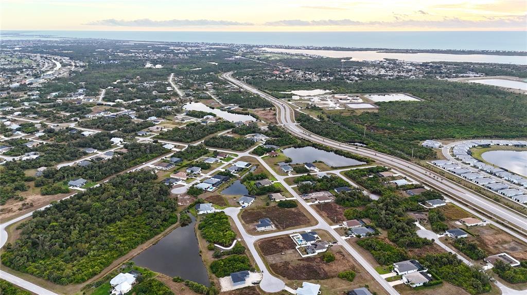 116 Temper Lane Rotonda West, FL 33947 - Photo 5 of 6 an aerial view of residential houses with outdoor space