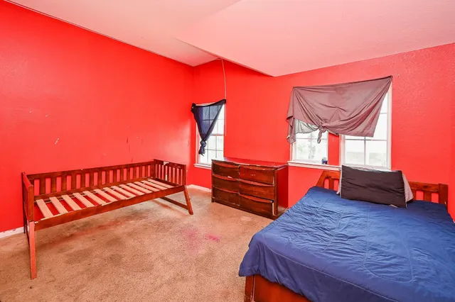 a balcony with a bench and wooden floor