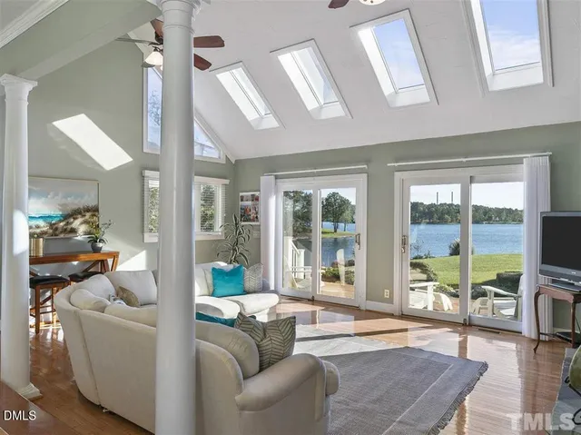 a view of a living room and floor to ceiling window