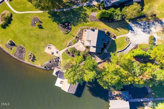 an aerial view of residential house with outdoor space and swimming pool