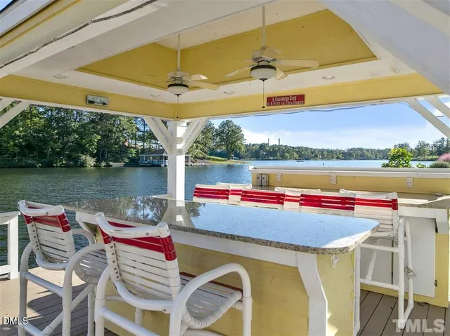 a view of balcony with chairs and wooden floor