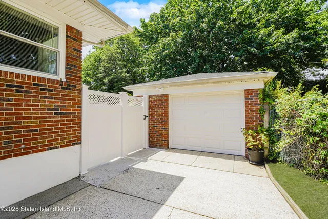 a view of a backyard with sitting area