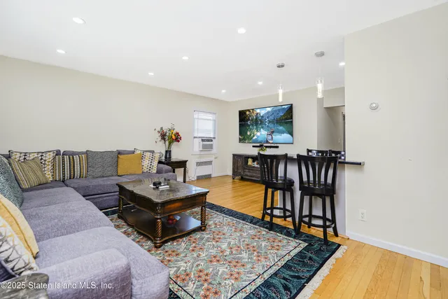 a living room with furniture and a rug