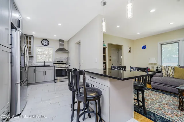 a kitchen with granite countertop a sink and stove