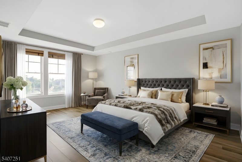 40 West Park Place, Unit 412 Morristown, NJ 07960 - Photo 11 of 32 a bedroom with a bed and wooden floor