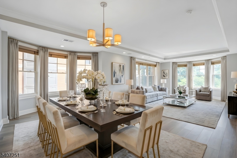 40 West Park Place, Unit 412 Morristown, NJ 07960 - Photo 2 of 32 a view of a dining room with furniture wooden floor and chandelier