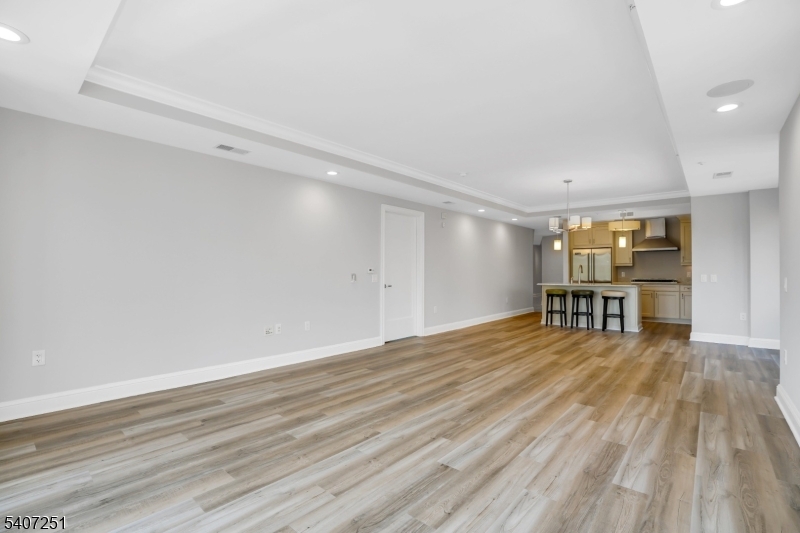 40 West Park Place, Unit 412 Morristown, NJ 07960 - Photo 9 of 32 a view of empty room with wooden floor