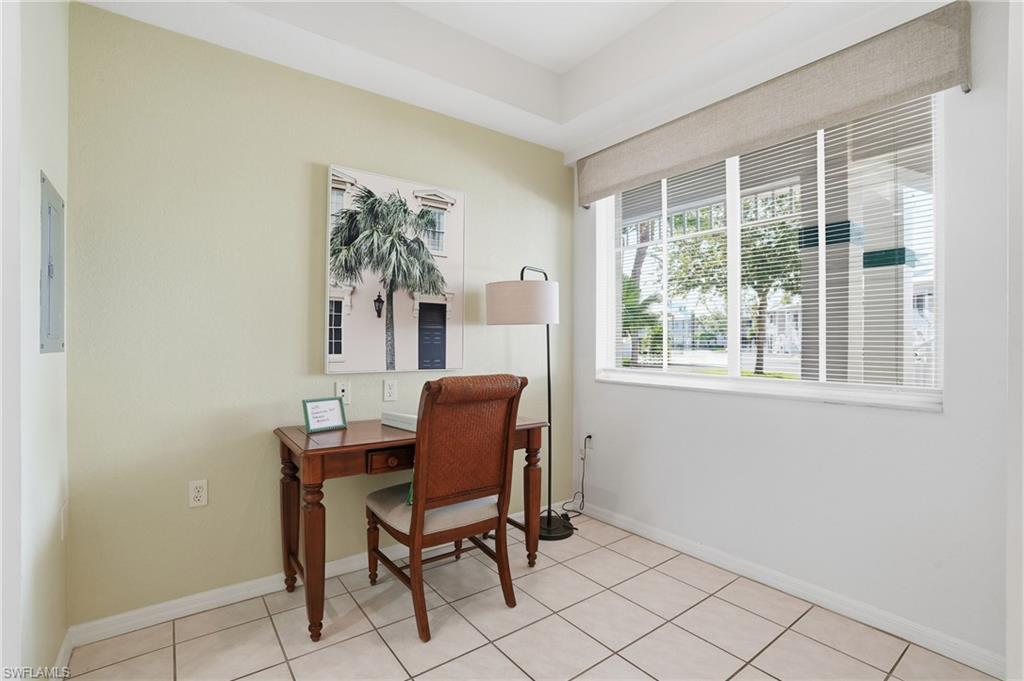 7920 Mahogany Run Lane, Unit 1015 Naples, FL 34113 - Photo 17 of 41 a workspace with furniture and a window