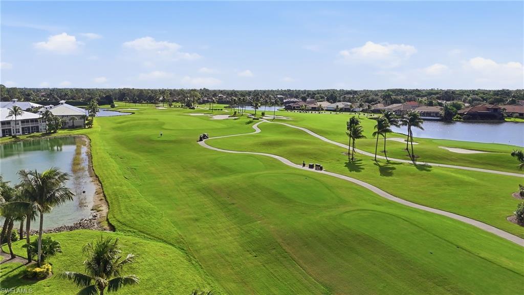 7920 Mahogany Run Lane, Unit 1015 Naples, FL 34113 - Photo 2 of 41 an aerial view of a golf course with a lake view
