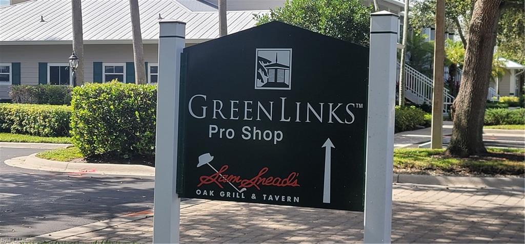 7920 Mahogany Run Lane, Unit 1015 Naples, FL 34113 - Photo 38 of 41 a sign on the side of the building