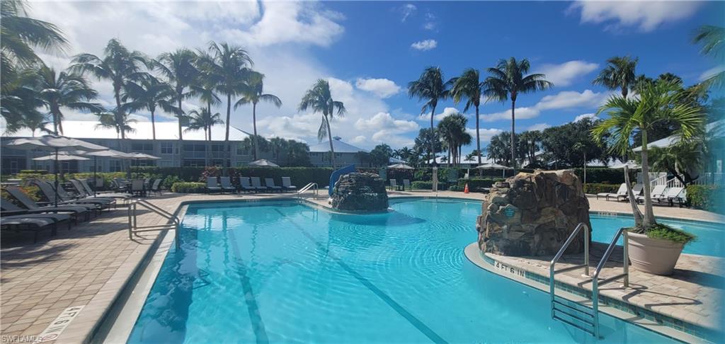7920 Mahogany Run Lane, Unit 1015 Naples, FL 34113 - Photo 8 of 41 a swimming pool with outdoor seating and yard