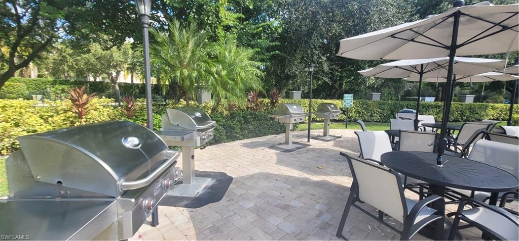 7920 Mahogany Run Lane, Unit 1015 Naples, FL 34113 - Photo 9 of 41 a view of a backyard with sitting area