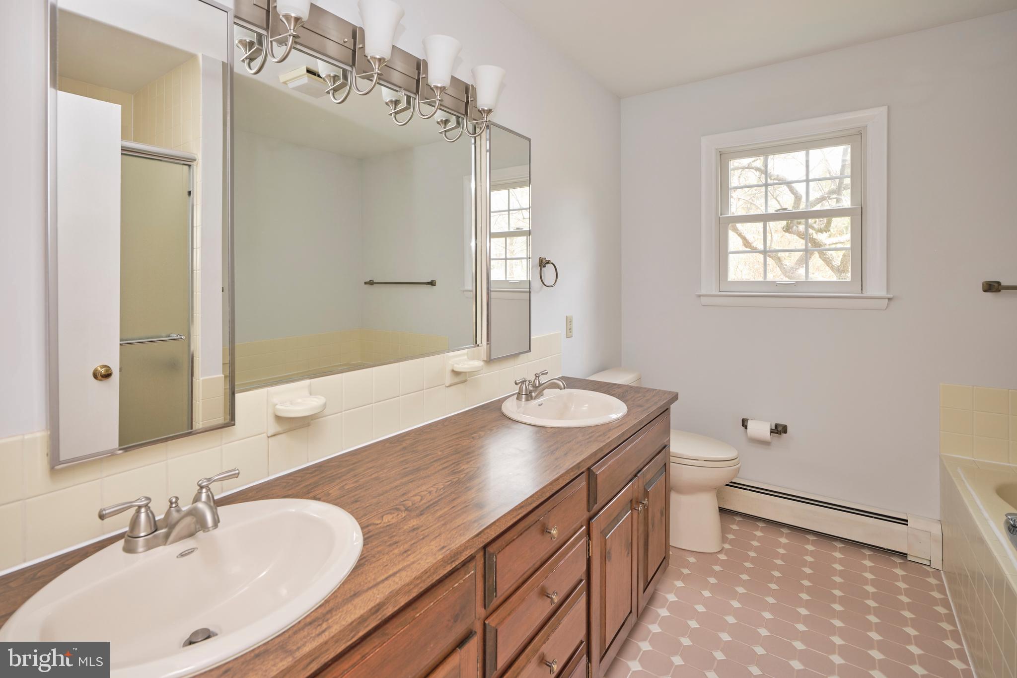 4902 Anderson Road Doylestown, PA 18902 - Photo 15 of 46 a bathroom with a sink double vanity granite and a toilet