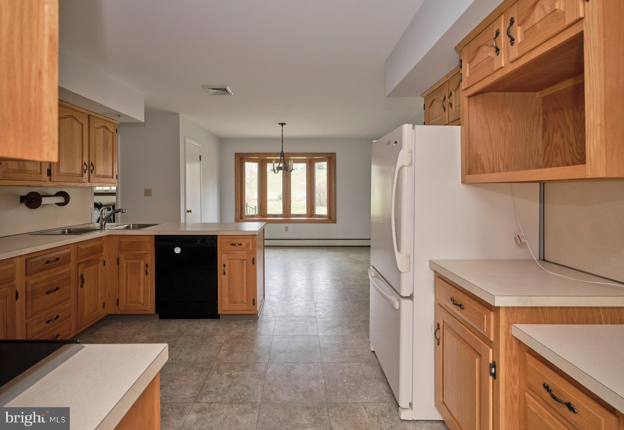 4902 Anderson Road Doylestown, PA 18902 - Photo 16 of 46 a kitchen with a refrigerator and a sink