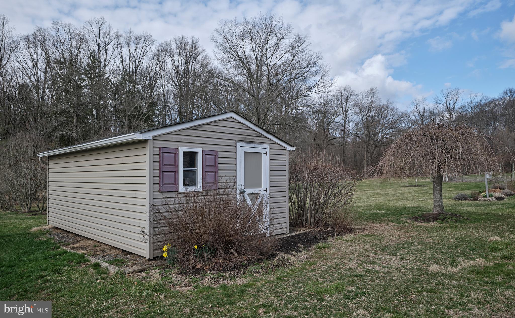 4902 Anderson Road Doylestown, PA 18902 - Photo 43 of 46 a front view of a house with garden