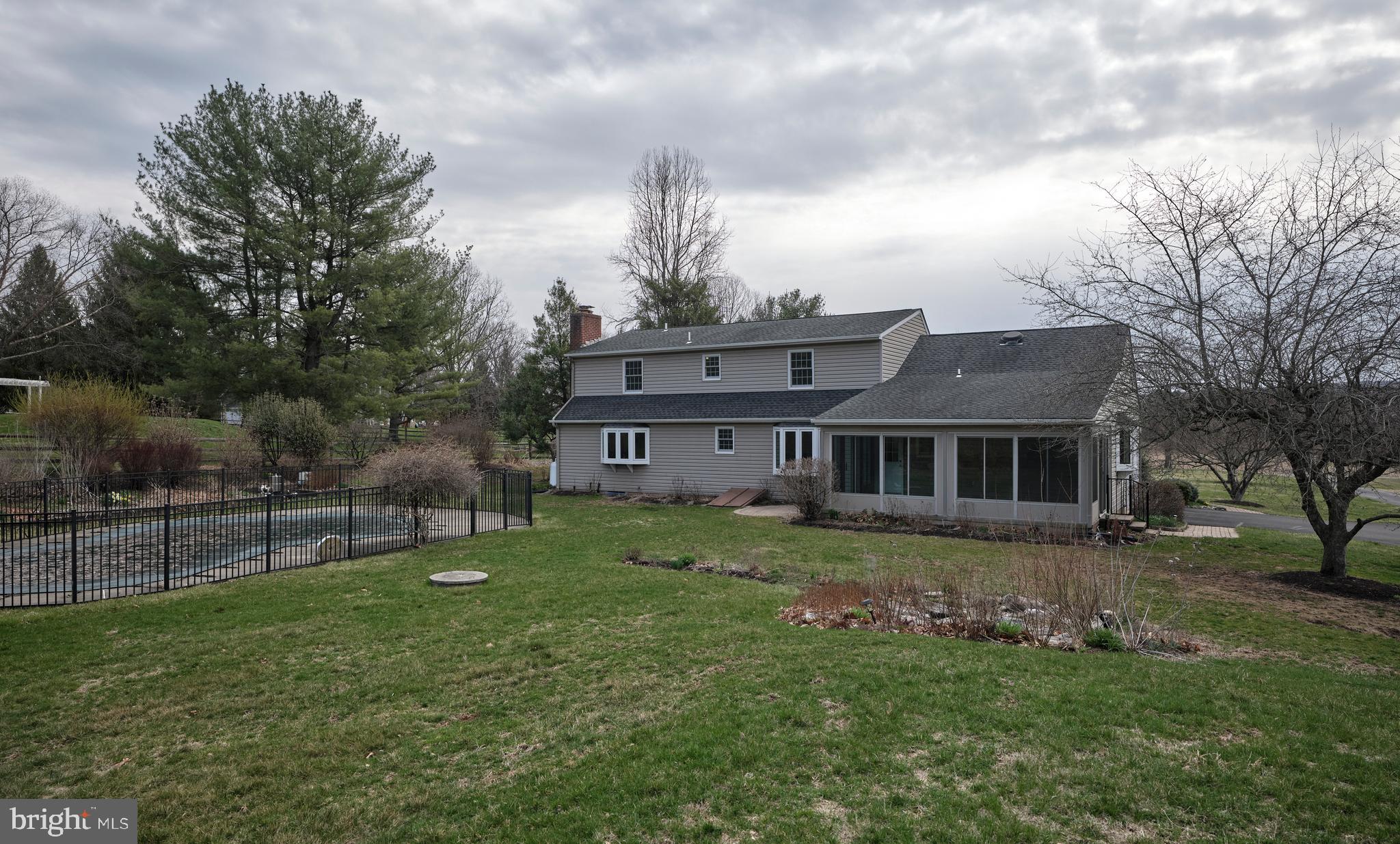 4902 Anderson Road Doylestown, PA 18902 - Photo 44 of 46 a front view of a house with a garden