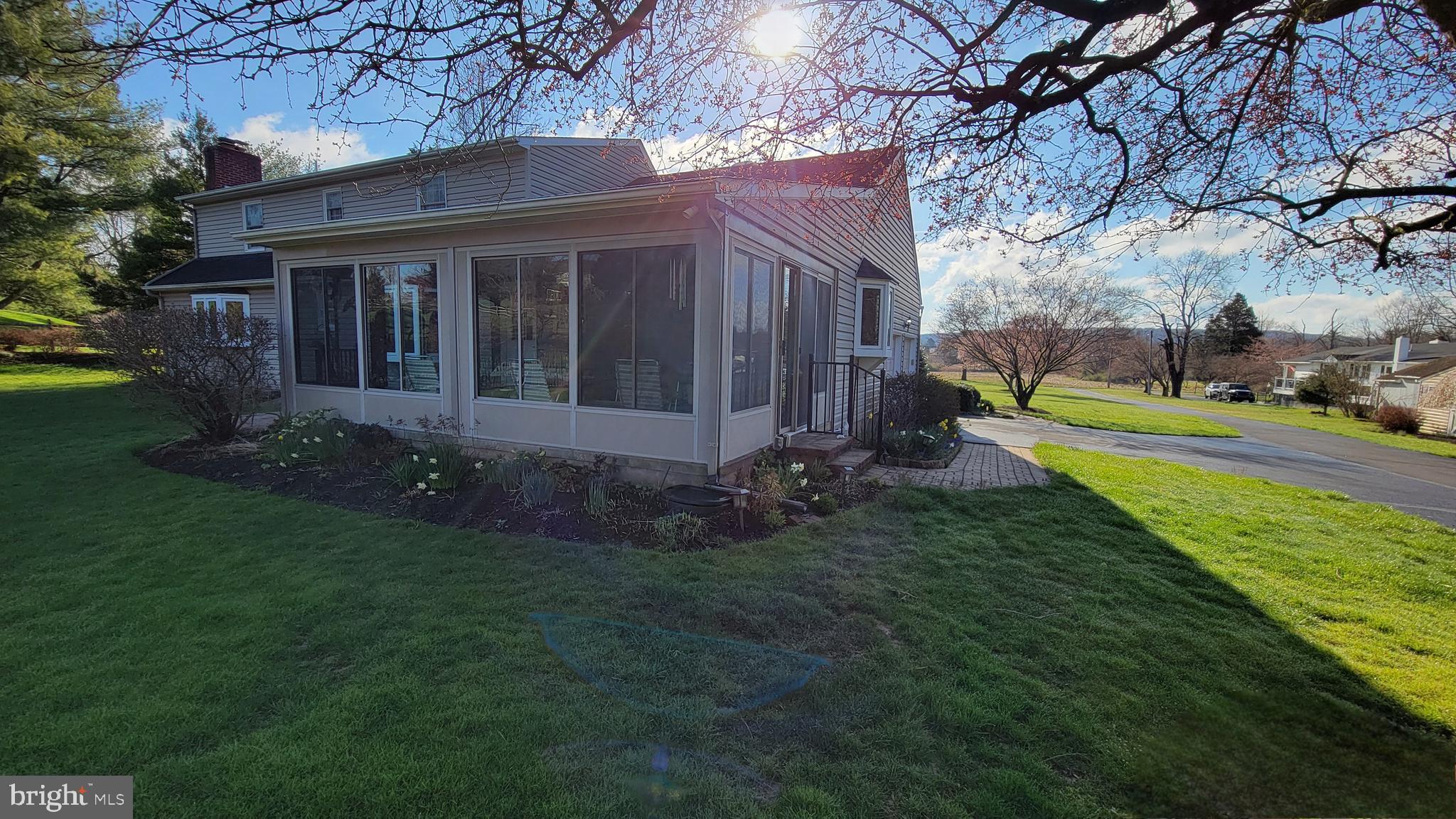 4902 Anderson Road Doylestown, PA 18902 - Photo 8 of 46 a view of a house with a yard patio and a fire pit