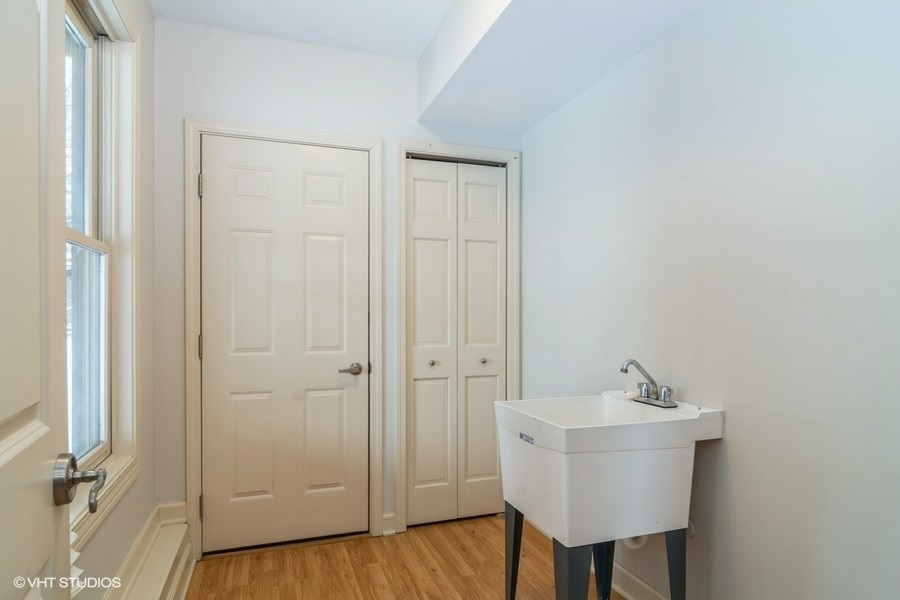 8 River Bend Road Montgomery, IL 60538 - Photo 22 of 25 a bathroom with a sink a mirror and a toilet