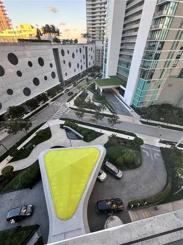 a view of a swimming pool with outdoor seating