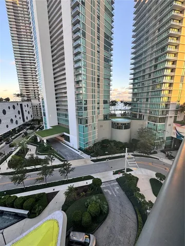 a view of balcony with wooden floor