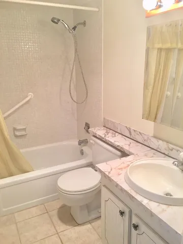 a bathroom with a sink a toilet and a bathtub