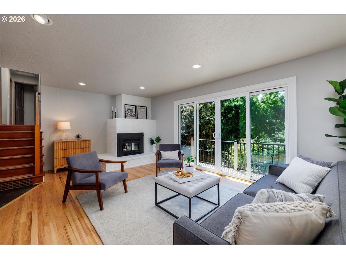 175 Northwest 95th Avenue Portland, OR 97229 - Photo 7 of 46 a living room with furniture and a fireplace