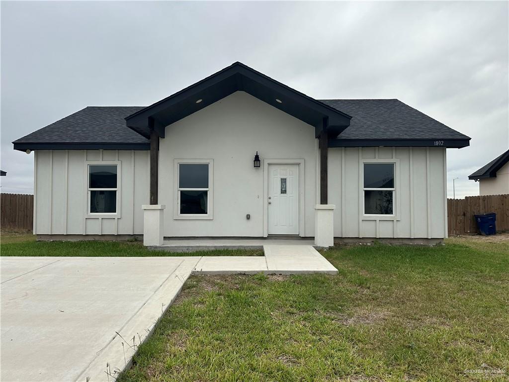 1802 Unity Drive Mercedes, TX 78570 - Photo 1 of 11 a front view of a house with a yard