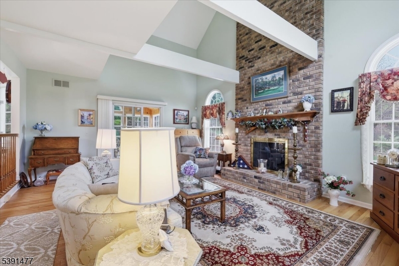42 Copper Penny Road Flemington, NJ 08822 - Photo 9 of 39 a living room with furniture and a fireplace