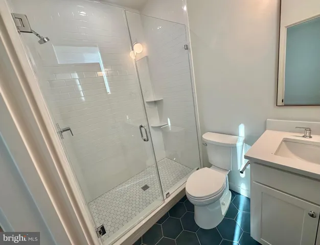 a bathroom with a toilet and a sink