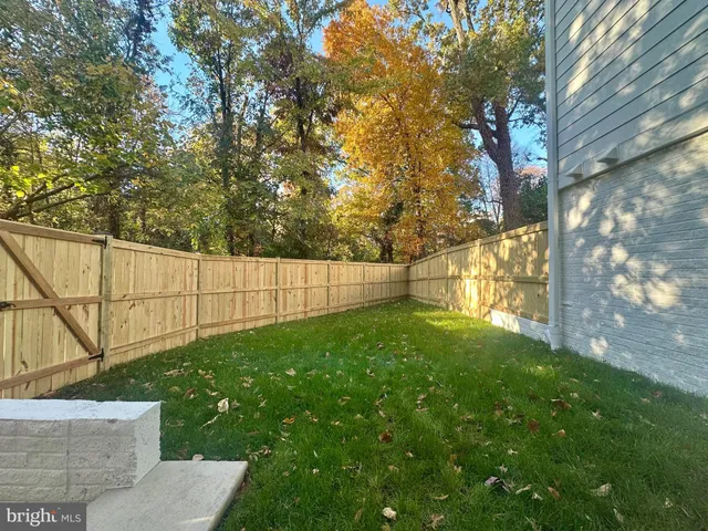 a view of backyard with green space