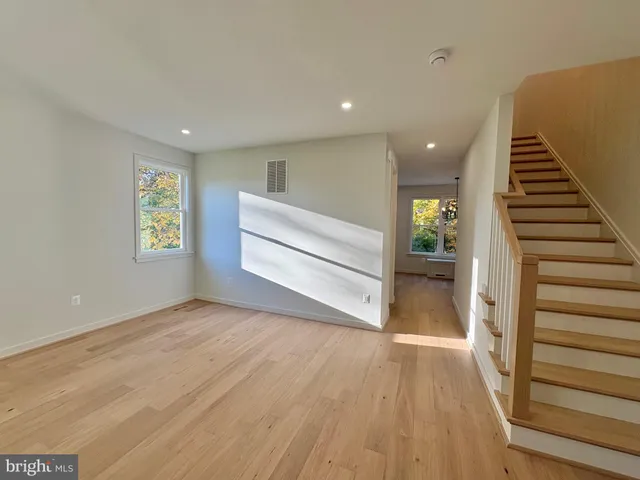 a view of entryway with wooden floor