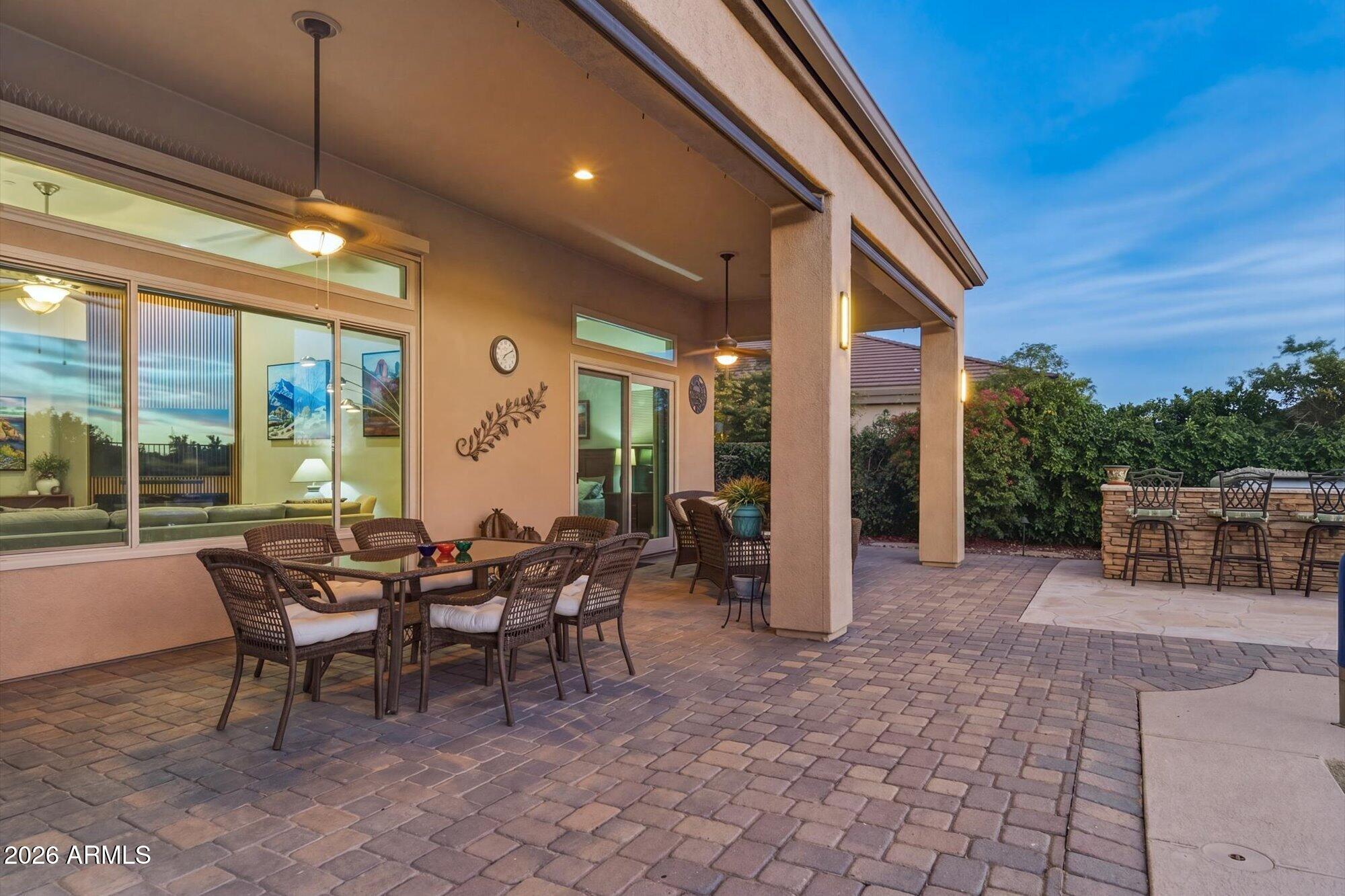 40322 North Hawk Ridge Trail Anthem, AZ 85086 - Photo 49 of 63 a group of people sitting in patio of a house