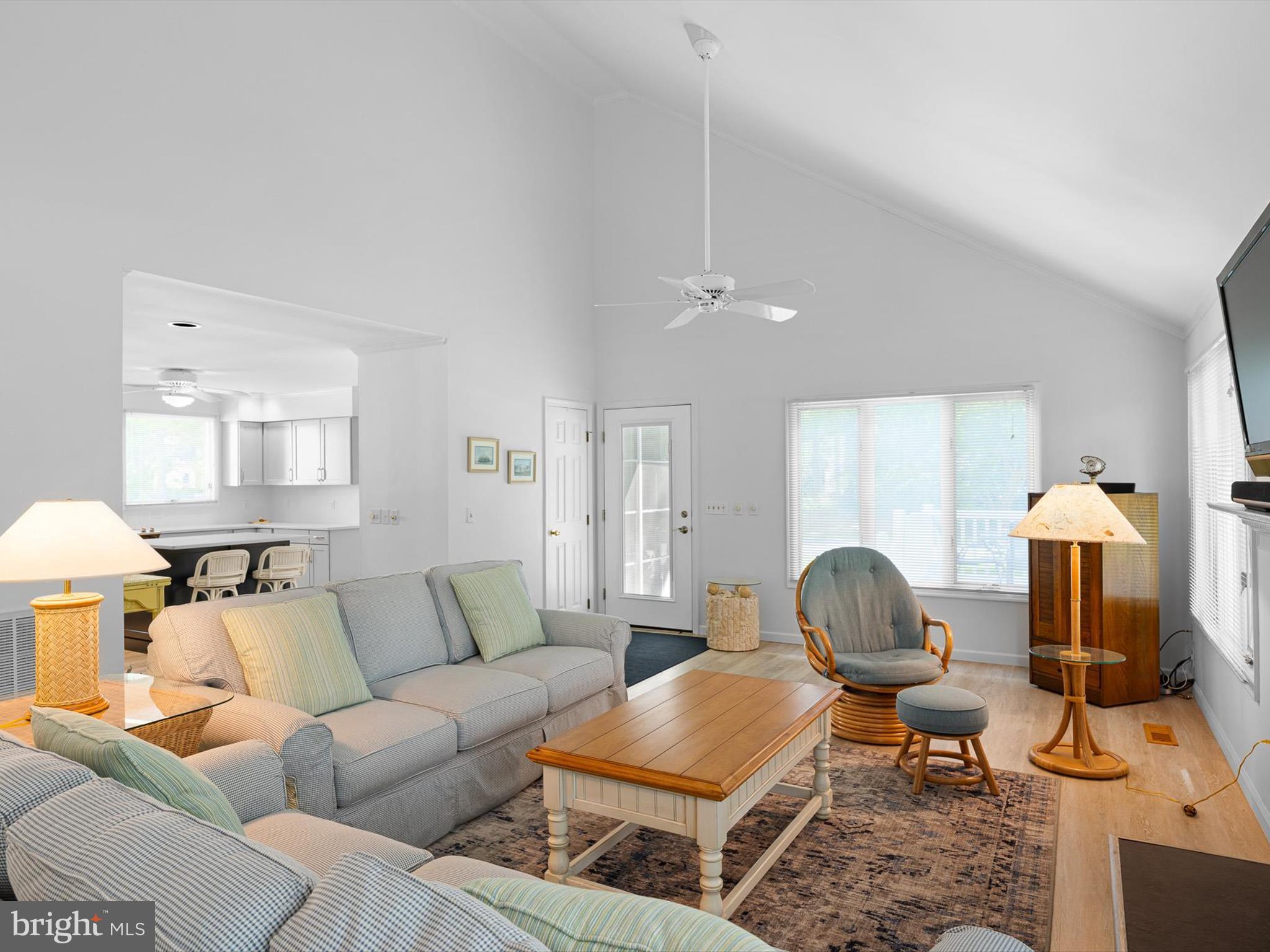 532 Bethany Loop Bethany Beach, DE 19930 - Photo 14 of 65 a living room with furniture a lamp and a chandelier