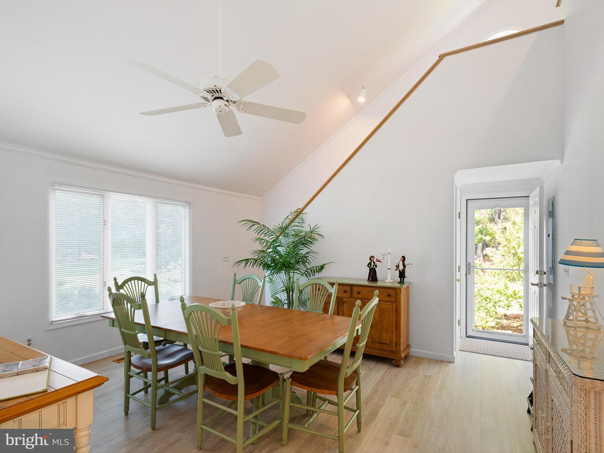 532 Bethany Loop Bethany Beach, DE 19930 - Photo 18 of 65 a dining room with furniture and window