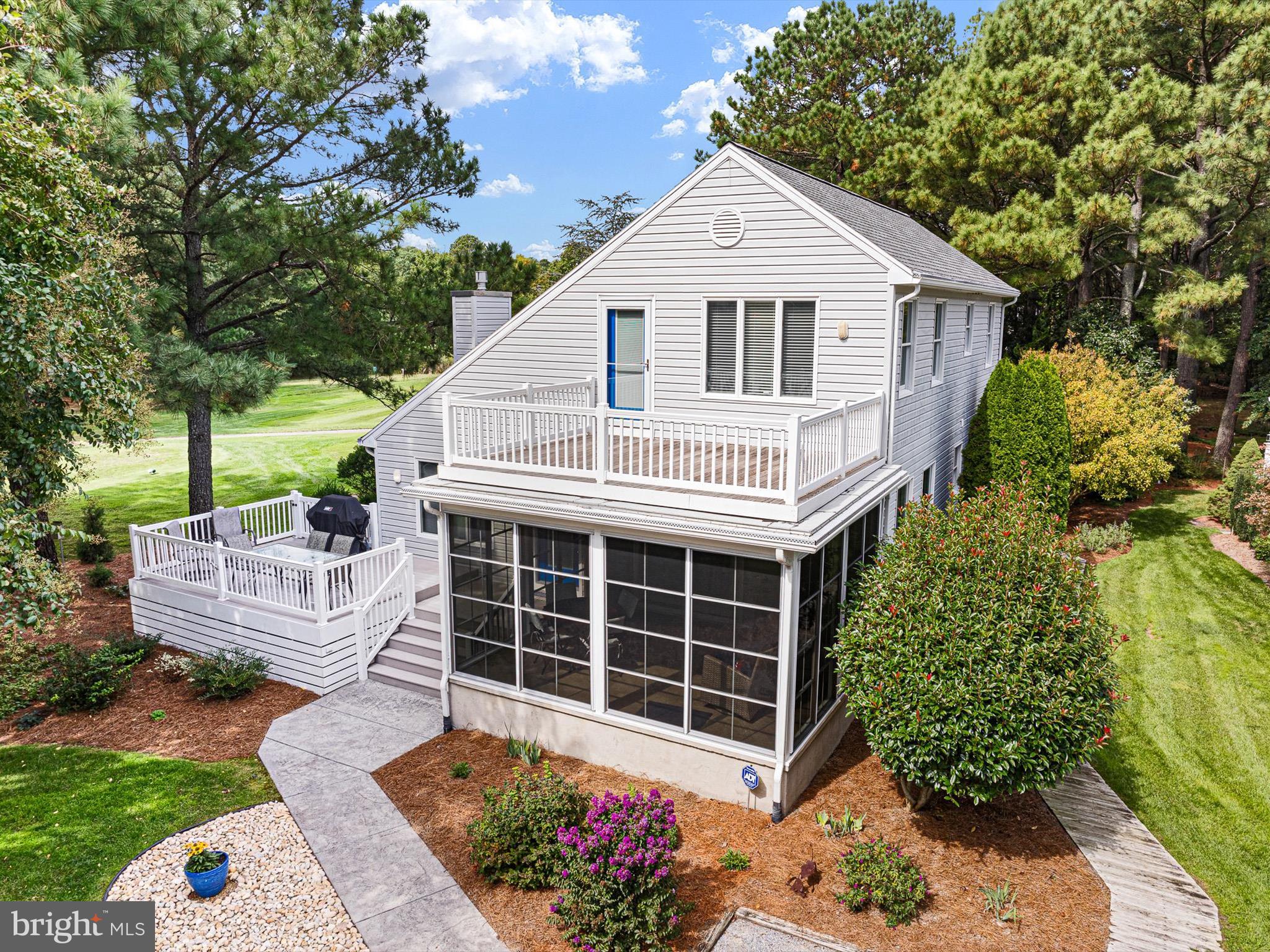 532 Bethany Loop Bethany Beach, DE 19930 - Photo 2 of 65 a view of a house with a yard and potted plants