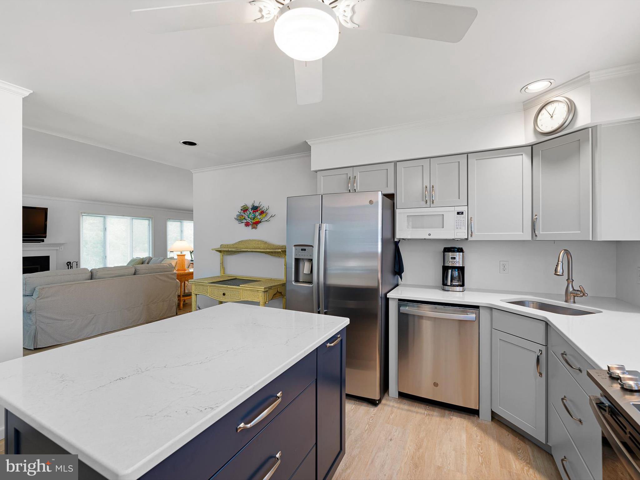 532 Bethany Loop Bethany Beach, DE 19930 - Photo 21 of 65 a kitchen with cabinets a sink a counter space stainless steel appliances and cabinets