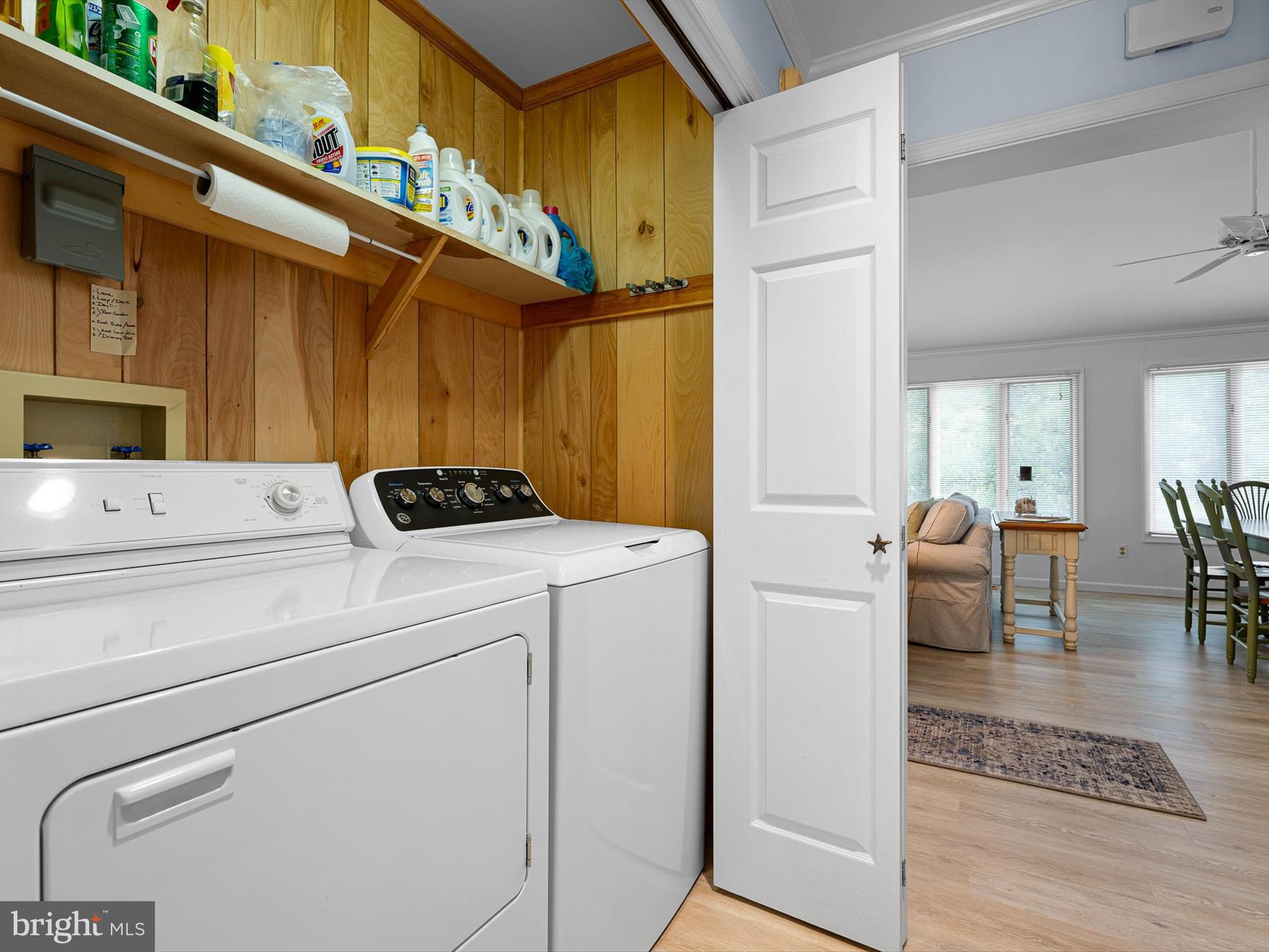 532 Bethany Loop Bethany Beach, DE 19930 - Photo 23 of 65 a view of washer and dryer with wooden cabinets